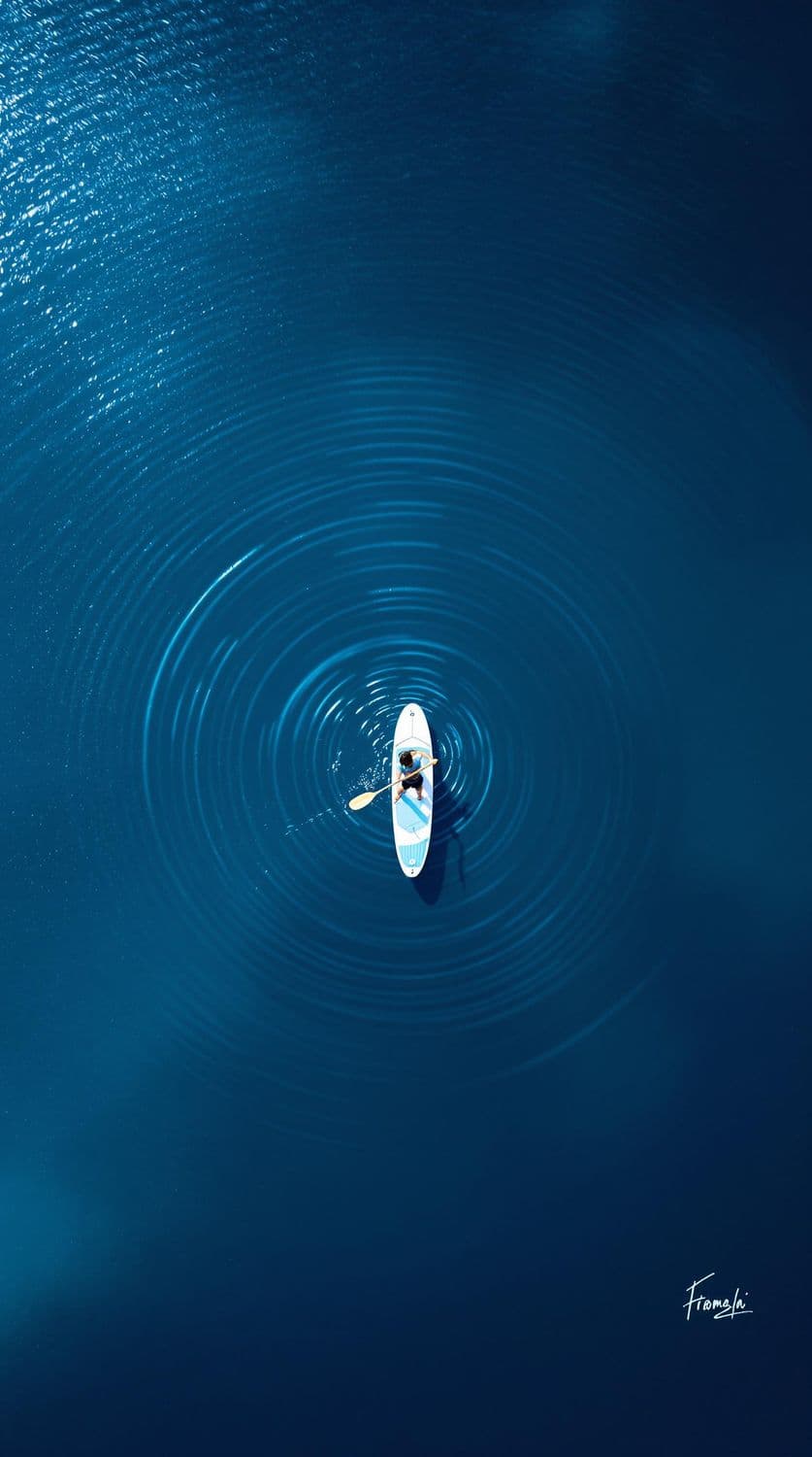 Paddleboarder on a Still Pond